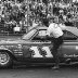 Ned Jarrett climbs in his office