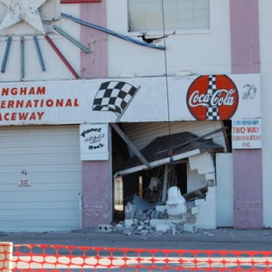 A wrecking ball takes out the ticket booth in the grandstands at BIR on Friday