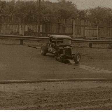 Sonny Black can be seen at left behind guardrail