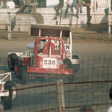 238, first with a wing perhaps. Putting in a gentle shove coming out of turn two. Don't fancy his chance though. Looks a little like David & Goliath, 238 looks tiny compared to the car in front of him