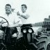 Tiger Tom and Tiny Lund on Tractor Hauling Hay.