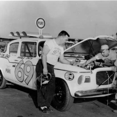 Harold Smith and crew check over his Studebaker before the start of the _59 Daytona 500_ He finished 31st___