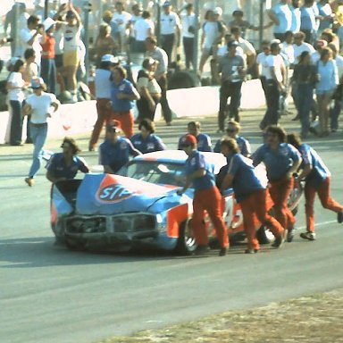 #43 Richard Petty's crew pushes car to garage  @ 1976 Daytona 500