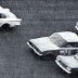 Here's a photo that should fit into the date criteria - Detroit's then new compact cars racing in Nascar. GM's Corvair, Chrysler's Valiant and Ford's Falcon