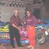 Slick Gibbons congratulates son Ed after winning super late model event at Sumter Speedway.