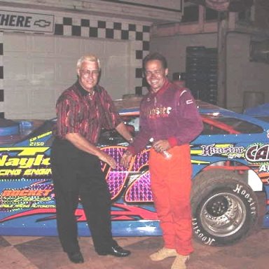 Slick Gibbons congratulates son Ed after winning super late model event at Sumter Speedway.