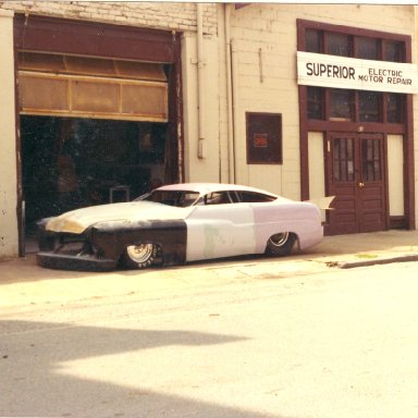 fletcher harrison merc in front of shop