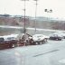 Tk & Ruth  working on ss-ha 69 Camaro in parking lot 1977 Indy