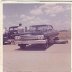 Dick Harrell in Hobbs, NM in 1962, under the car