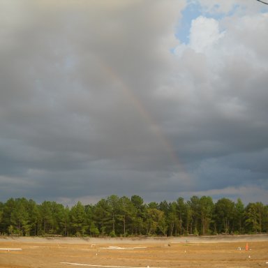 Rainbow and irrigation pipe in work at Columbia Speedway