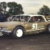 George Fisher Sr in car in pits 1969 TRIBUTE CAR TO HIS SON LOST IN VIETNAM