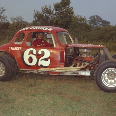 Jim Smoker seated in coupe in pits 1969