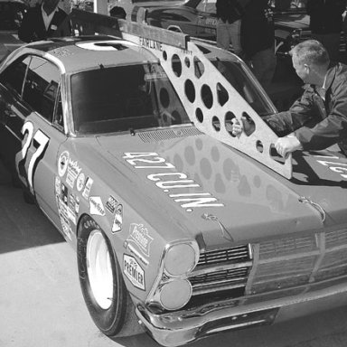 The Banjo Matthews Ford of A_J_ Foyt gets a template check before the 1967 Daytona 500___