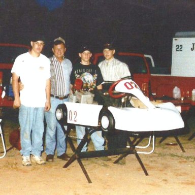 Billy Scott With His Prized Trophies--Grandsons