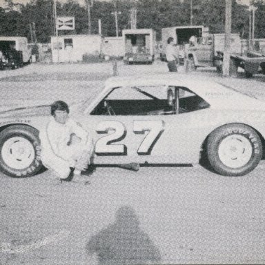 Sam Sommers with Jack Pennington's freshly painted car in the background.