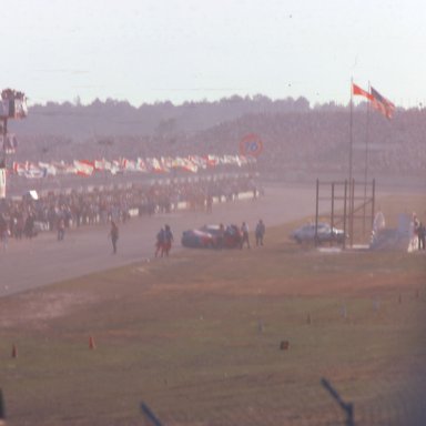 #43 Richard Petty 1976 crew pushes car back to garage after Daytona 500