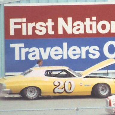 Jim Reep Jr working on Rick Newsom's Ford @ MIS 1978