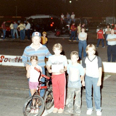 Butch giving a girl a bike she won