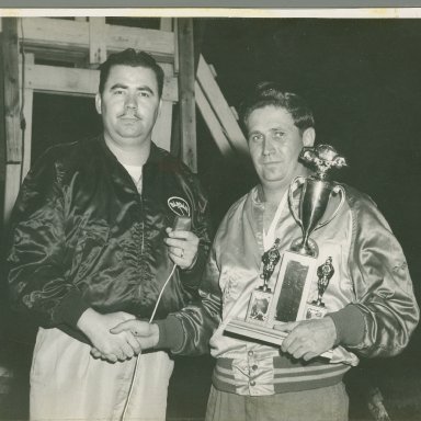 Zervakis holding Trophy