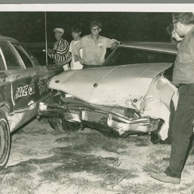 Butch Zervakis checking out the damage as Sonny Hutchins looks on