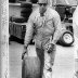 Dick Hutcherson Rolling a Tire Press Photo