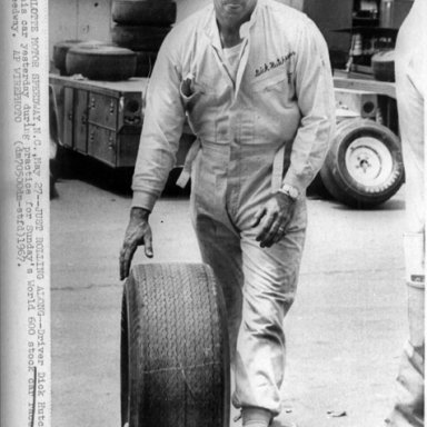 Dick Hutcherson Rolling a Tire Press Photo