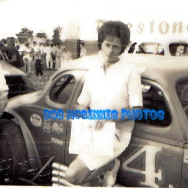 MY AUNT PEGGY MCGINNIS BESIDE BUCK DUVALS CAR BOB MCGINNIS DROVE.