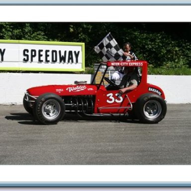 Ralph Monhay getting the flag for his 3 lap ride at the Langley Heritage speedway Langley BC Canada