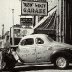 Red Vogt with a Roy Hall car outside his famous Spring Street Shop