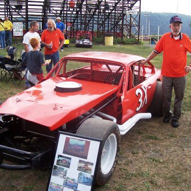 Benny Stephens stands next to the restored original Joe Norton owned 3X at the Shangri-La finale