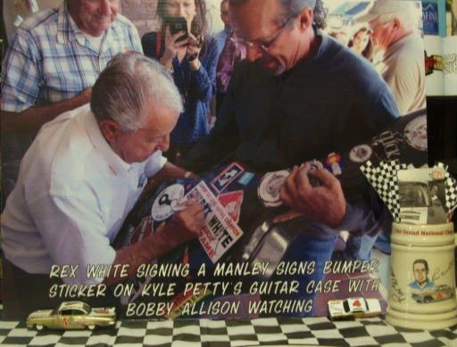 Rex White Signing Manley Signs Bumper Sticker On Kyle Petty Guitar Case ...