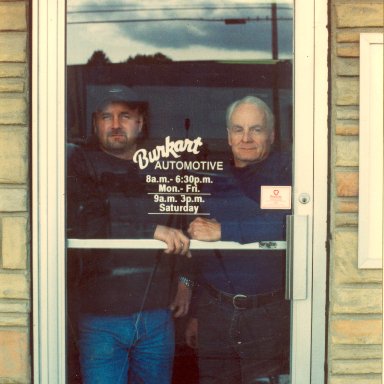 The Phil Burkarts Jr and Sr in shop door