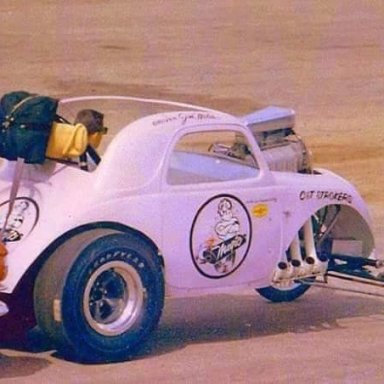 My Dad in the purple Magic Muffler car