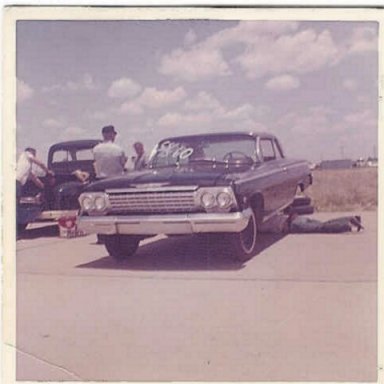 Dick Harrell in Hobbs, NM in 1962, under the car